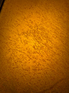Close up detail of buckskin color rawhide on lamp shade