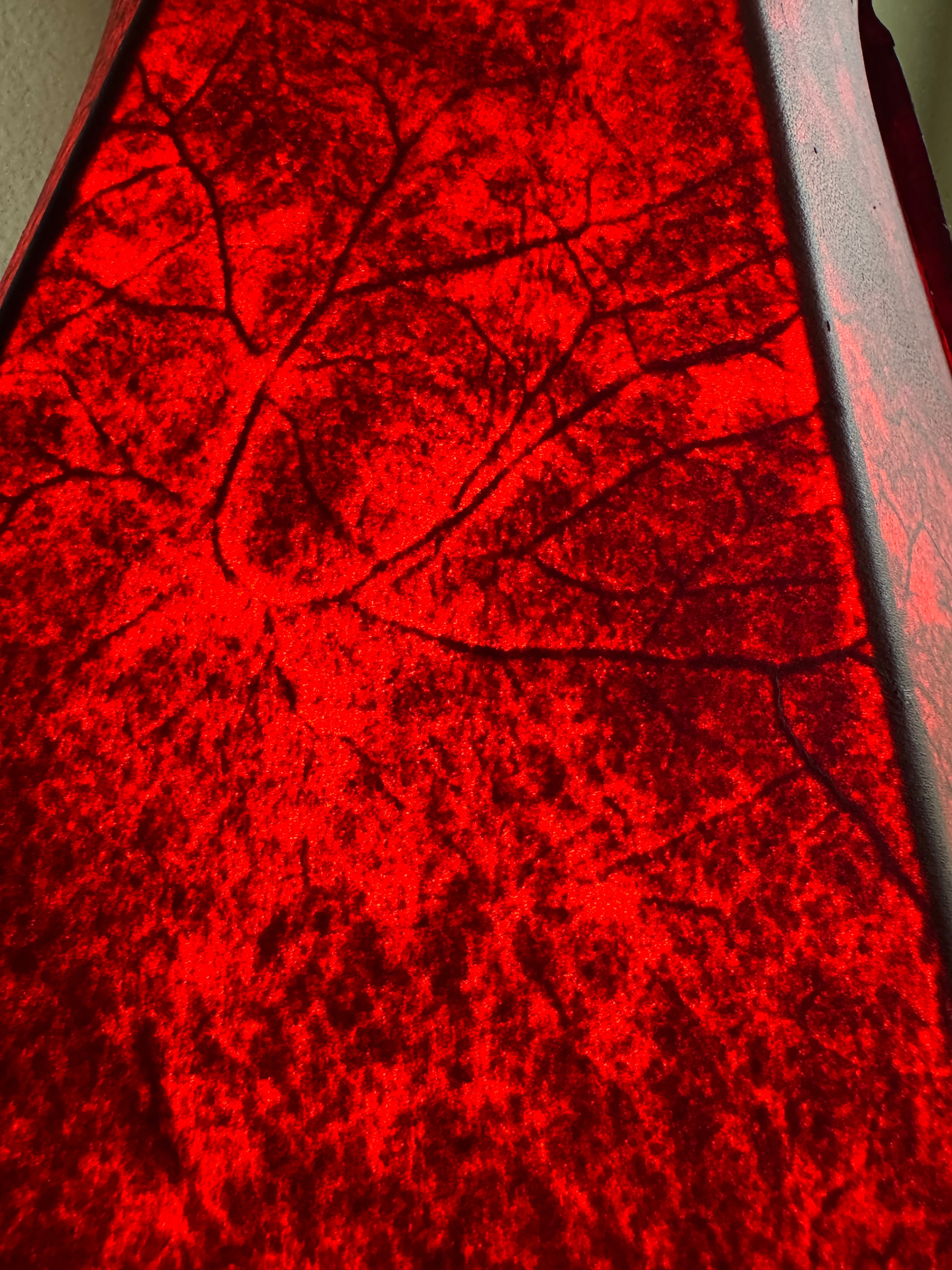 Close up detailed image of red rawhide on round 16" lamp shade 