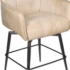 Close up of leather upholstery and iron frame on swivel counter stool 