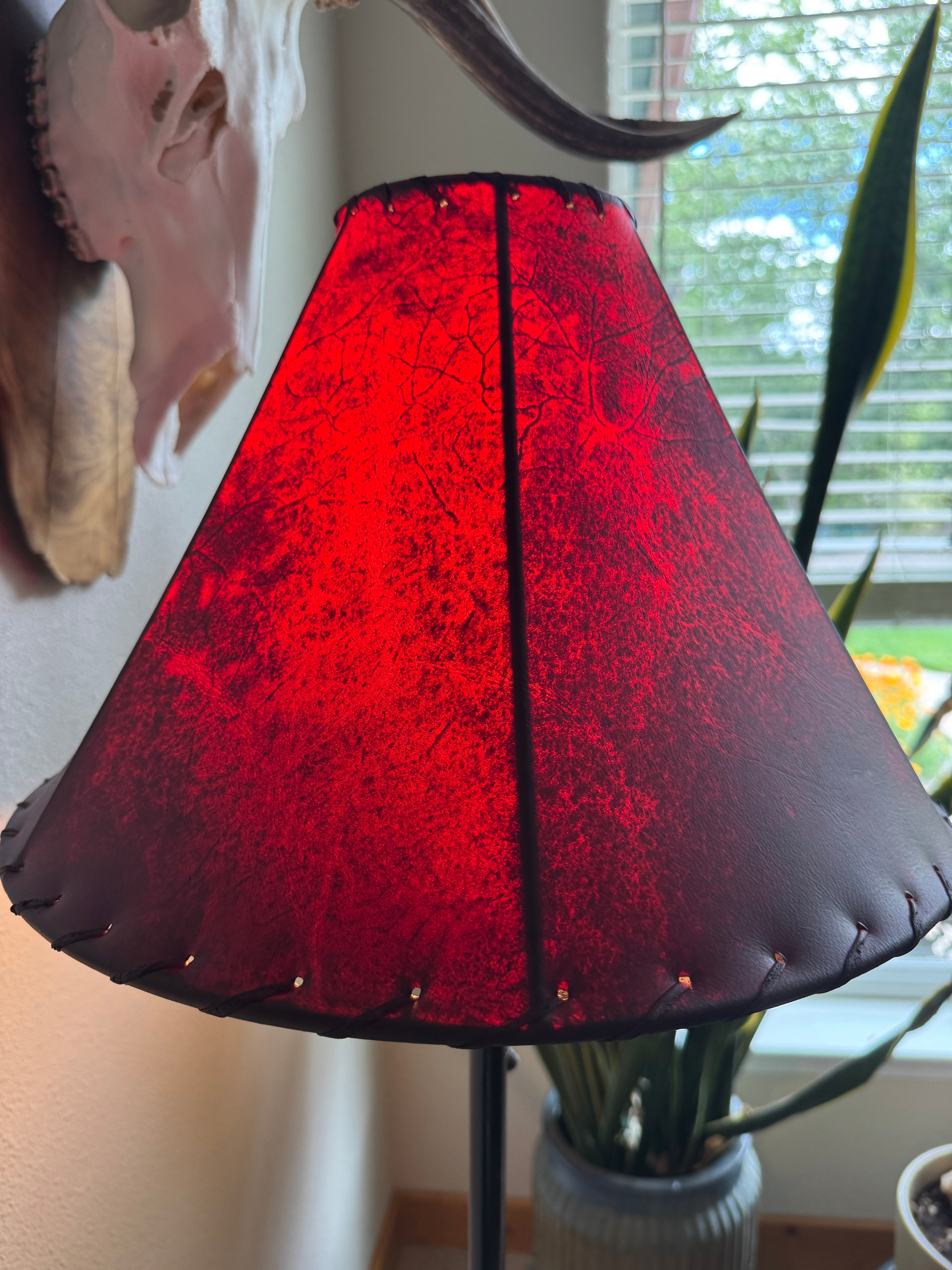 Red rawhide lamp shade 16" round showing veins and detail 