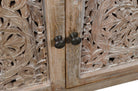 Detail of hand carved doors on tv console sideboard