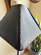 close up image of corner and outer stitchin on teal rawhide lamp shade