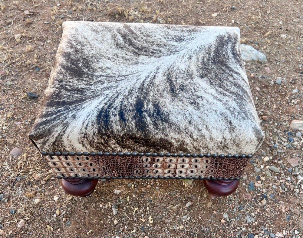 western cowhide ottoman with croc leather and nailhead trim