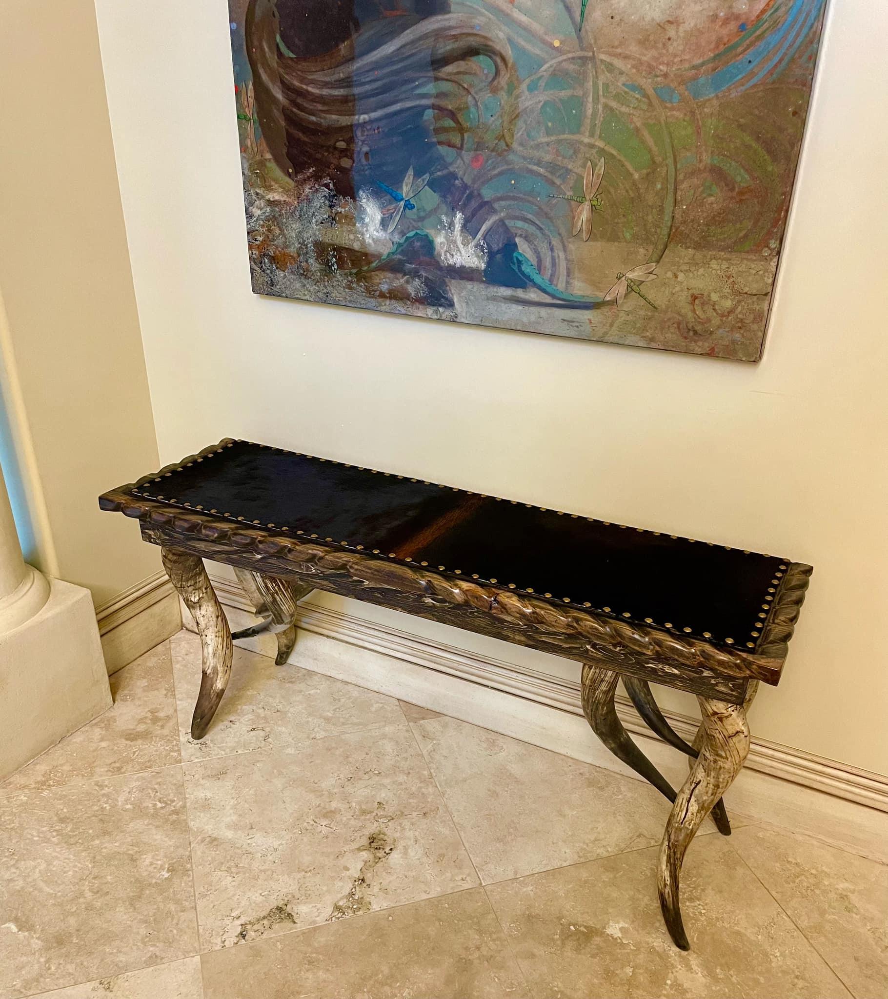 Handcrafted cowhide sofa table for ranch and lodge interiors