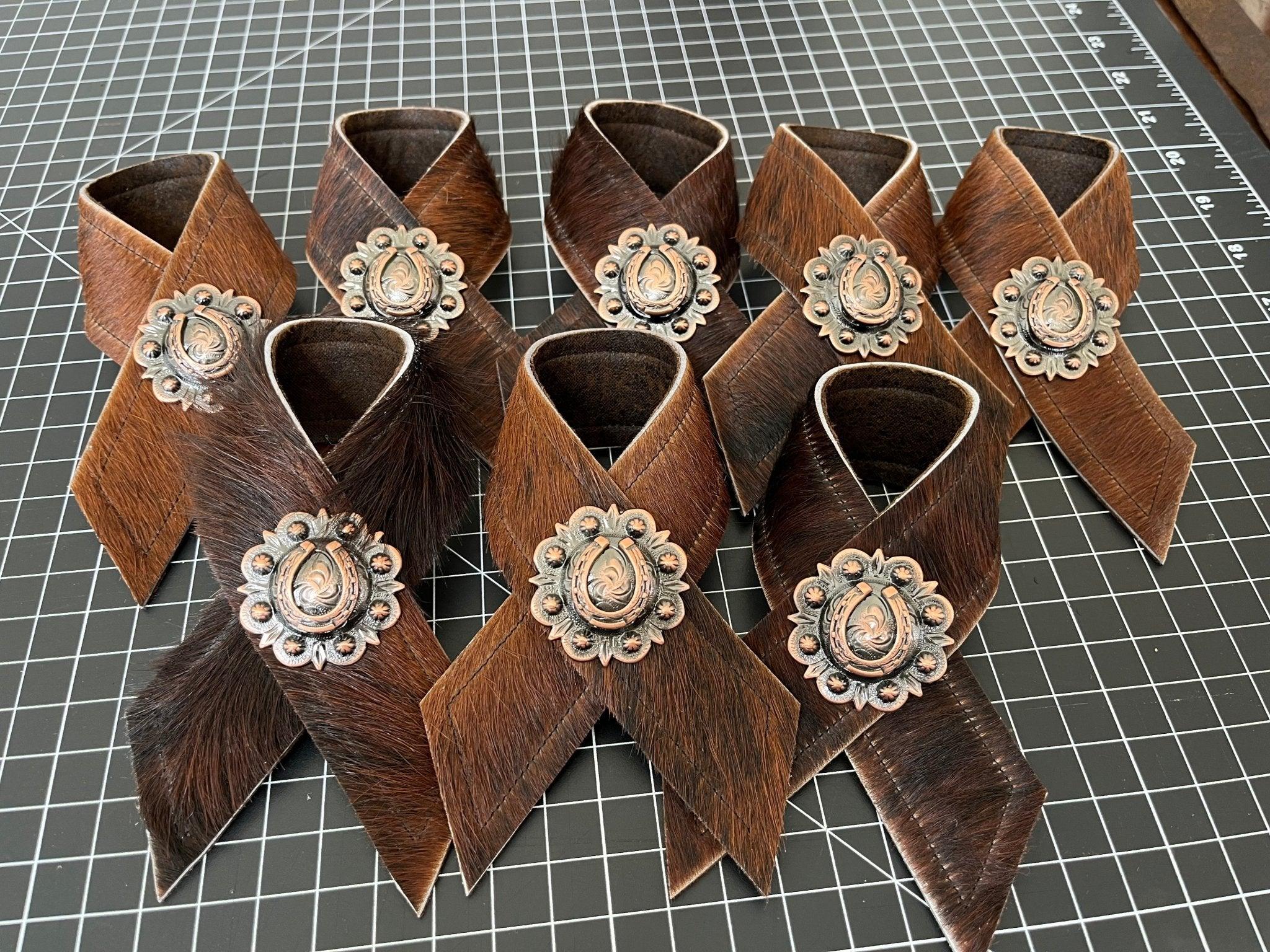 Brindle cowhide and horseshoe concho napkin rings handmade in the USA by Your Western Decor