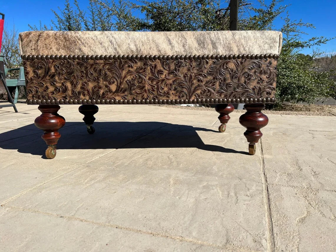 Brindle cowhide top with embossed leather lower, nail head tacking, ottoman on casters, custom made in the USA 