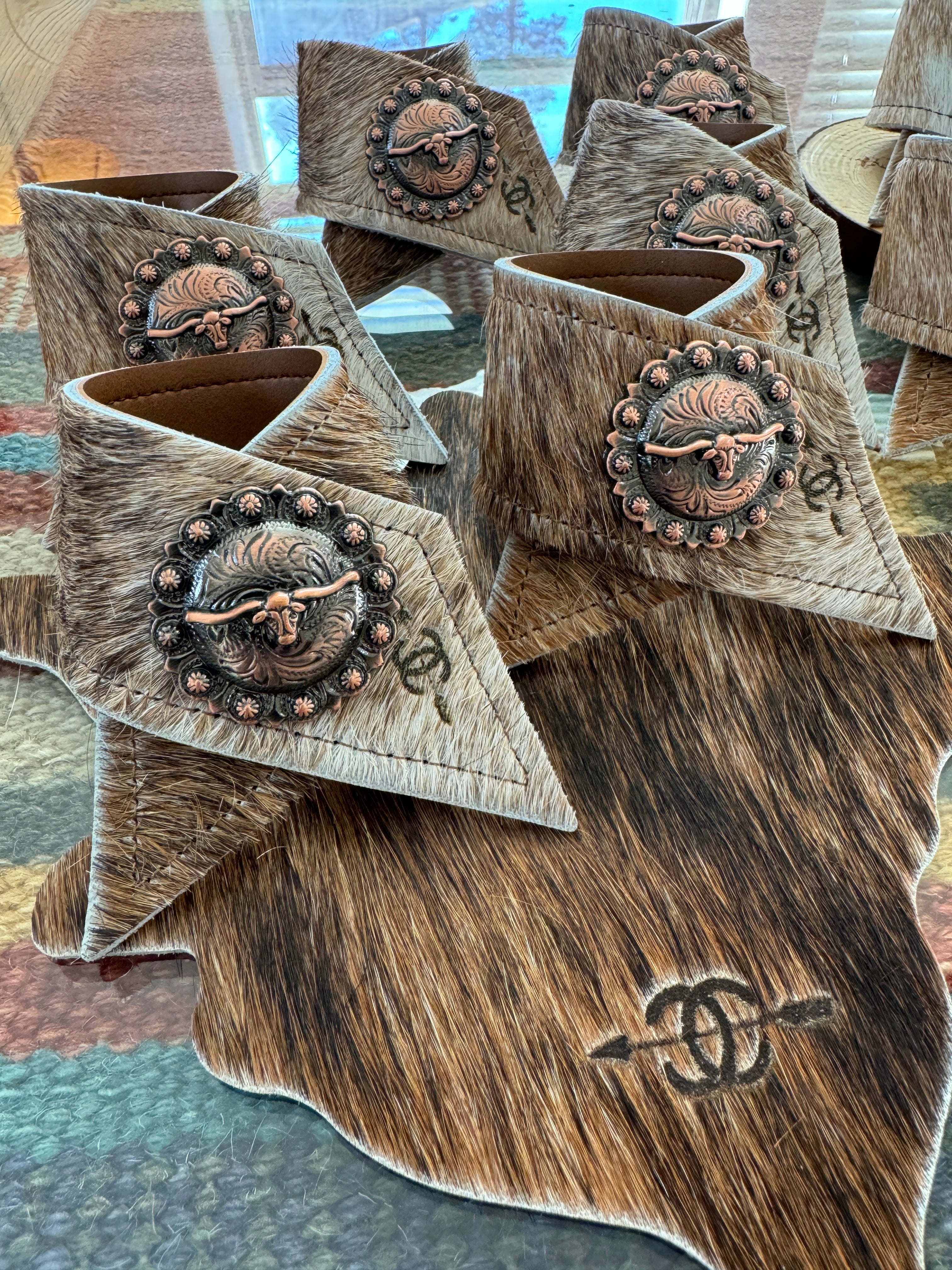 Custom laser branded cowhide napkin rings and coasters - Handmade by Your Western Decor