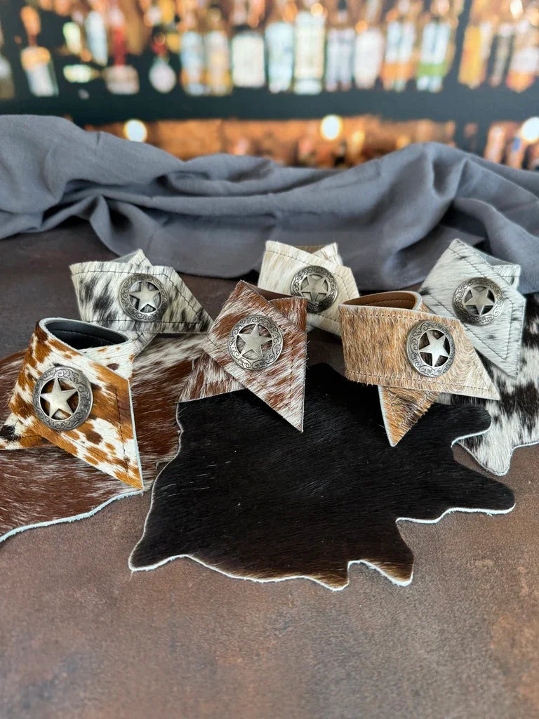 cowhide napkin rings with Texas star conchos western ranch table decor handmade hair on hide napkin rings