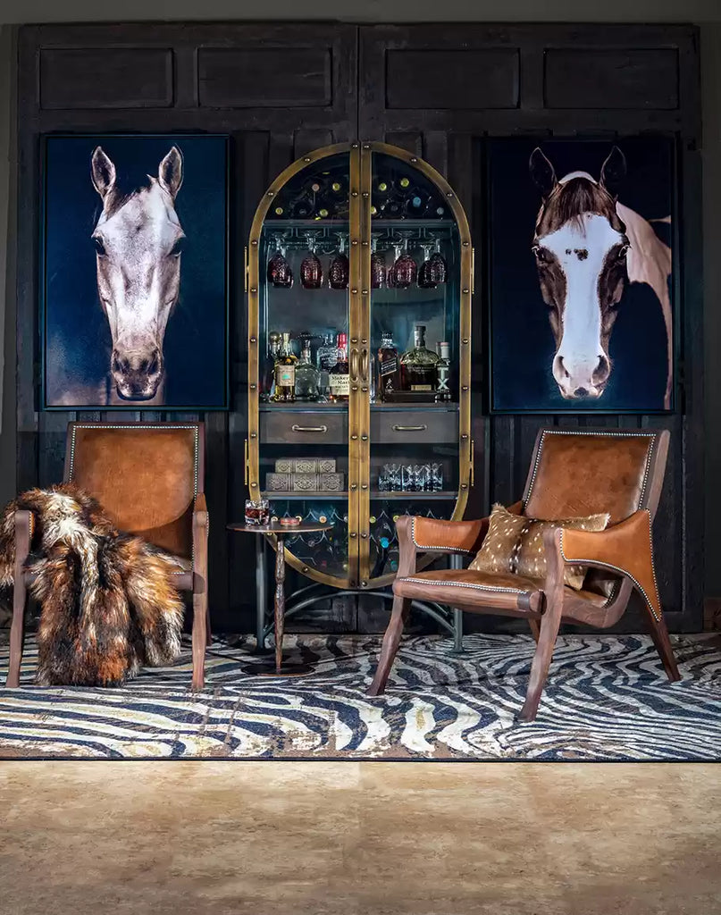 Luxury rustic lounge area with cabinet, horse art, leather chairs and decor - Your Western Decor