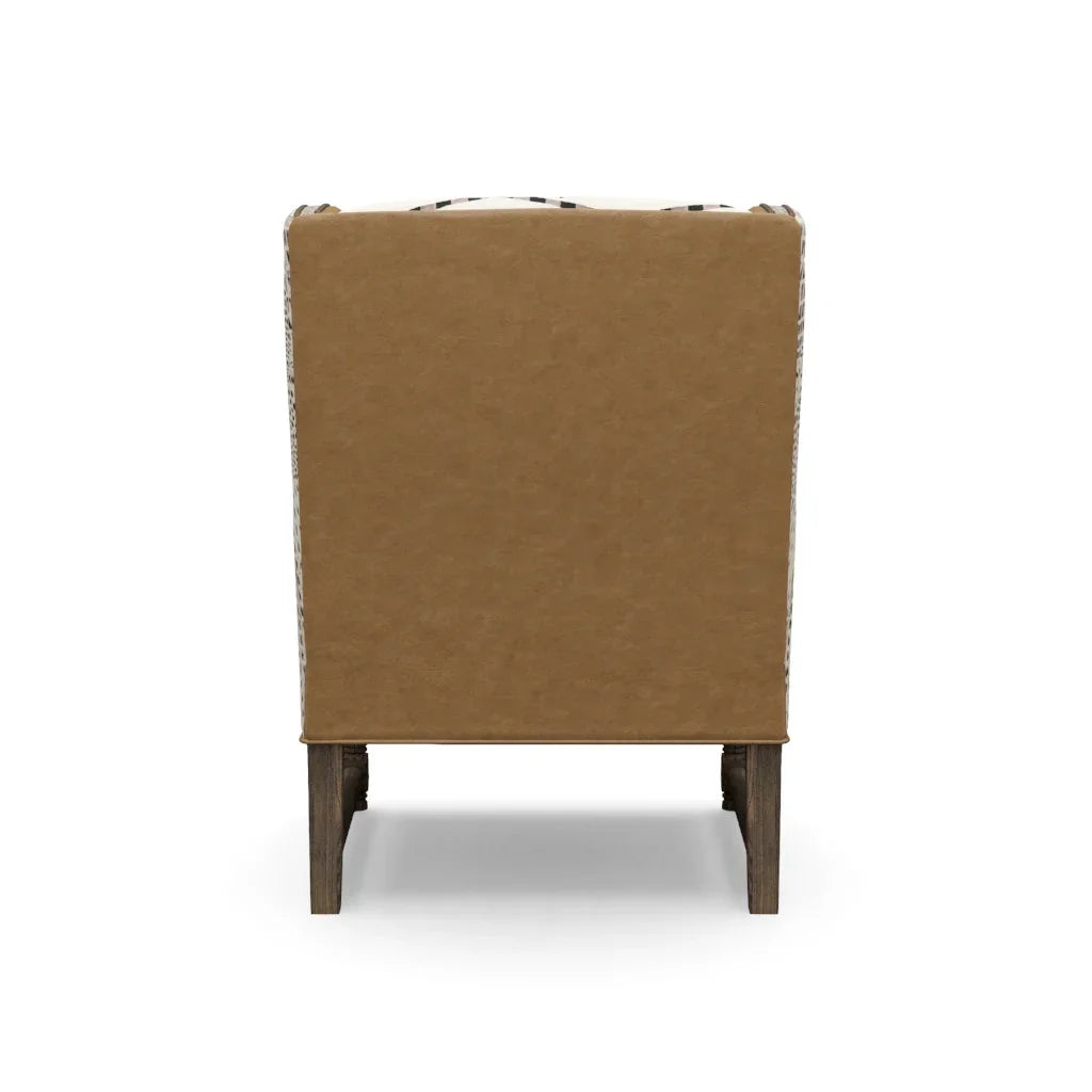 Brown upholstered chair with wooden legs on a white background