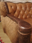 Close up of croc leather upholstered loveseat arm - Your Western Decor