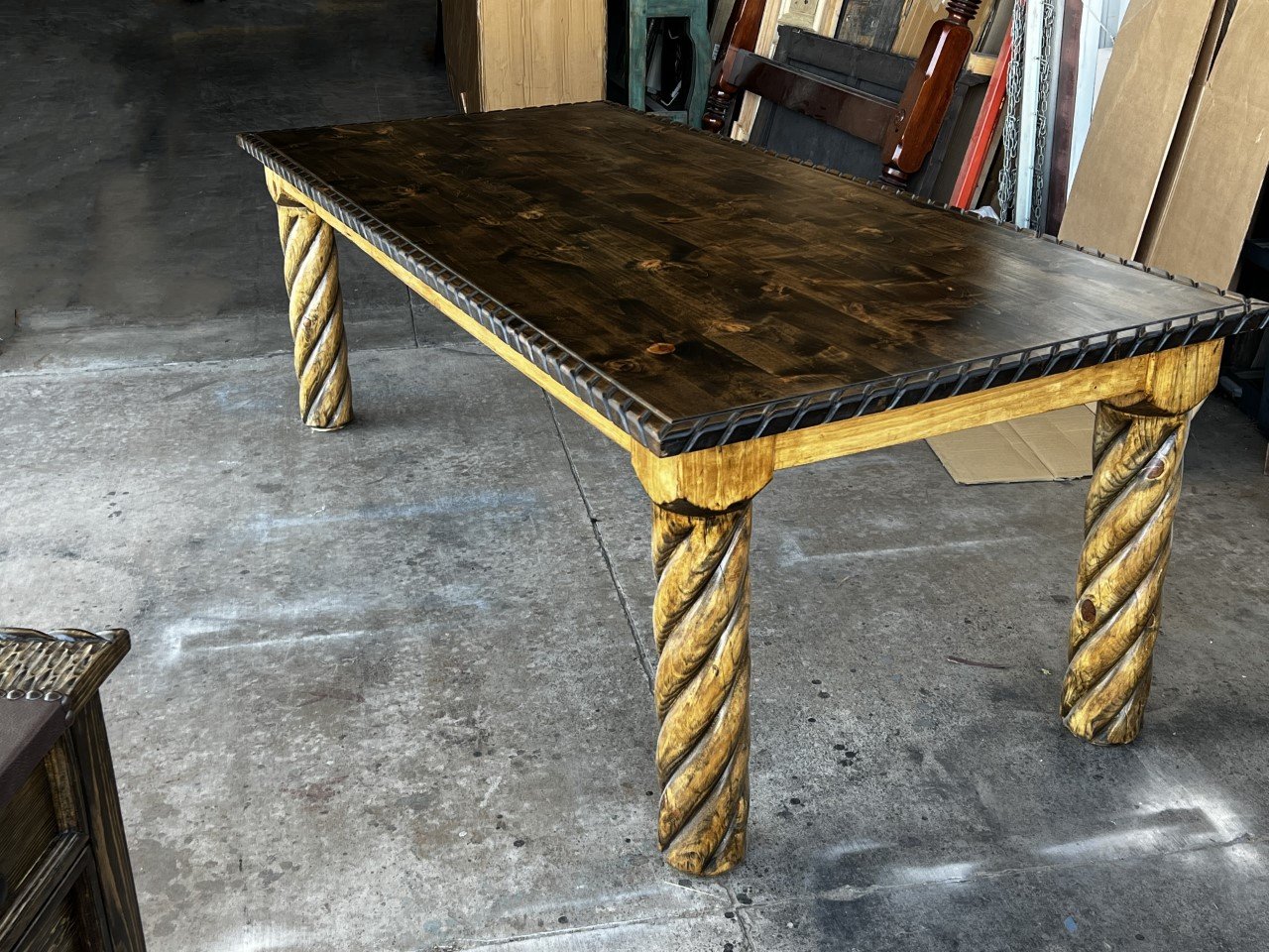 Custom Western dining table with rope carved trim