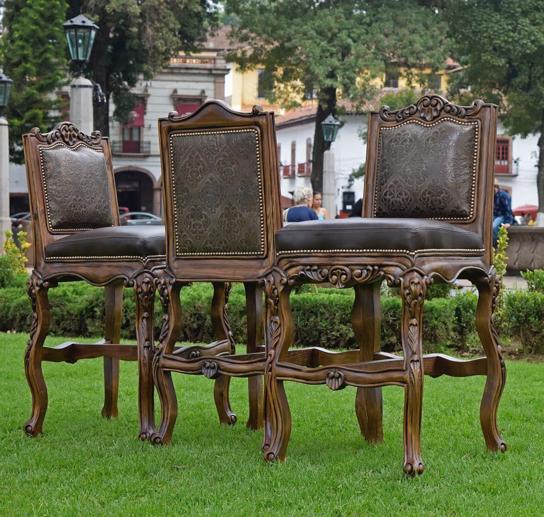 Three ornate wooden chairs with upholstered seats on a grassy area - Your Western Decor