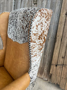 Western leather wingback office chair with cowhide accents and nail trim custom made to order