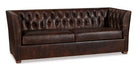 Brown leather sofa with tufted backrest on a white background - Your Western Decor