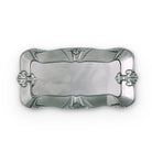 Silver decorative tray with intricate designs on a white background