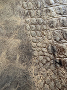embossed croc brown leather close-up