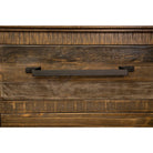 Wooden drawer with a metal handle on a white background