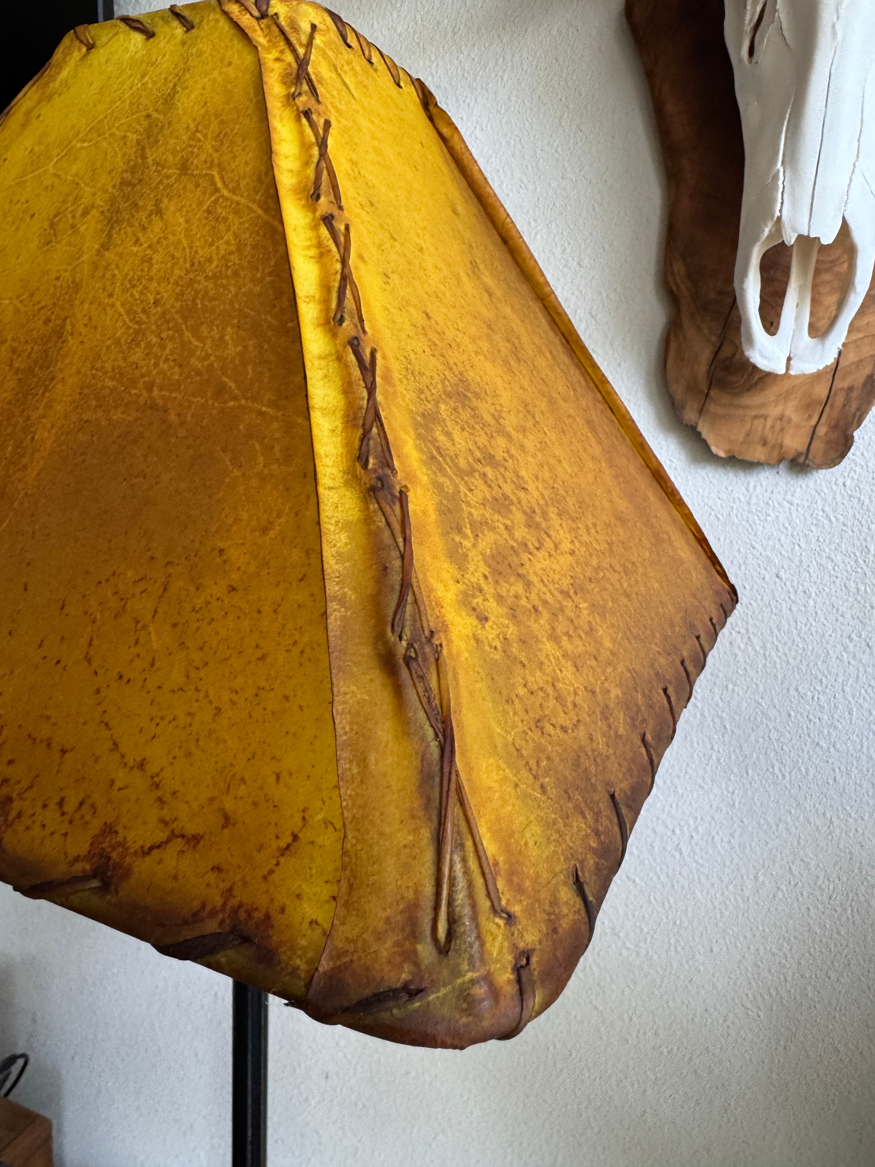 detail of hand lacing and whip stitch on buckskin rawhide leather lamp shade