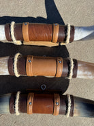 Leather wrapped center of longhorn wall mounts