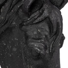 Close up detail of black horse wall sculpture 