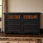 Distressed black 6-drawer dresser with top drawers upholstered in brindle cowhide with nailhead trim and black iron drawer pulls 