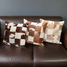 Brown and white cowhide patchwork pillows - Your Western Decor