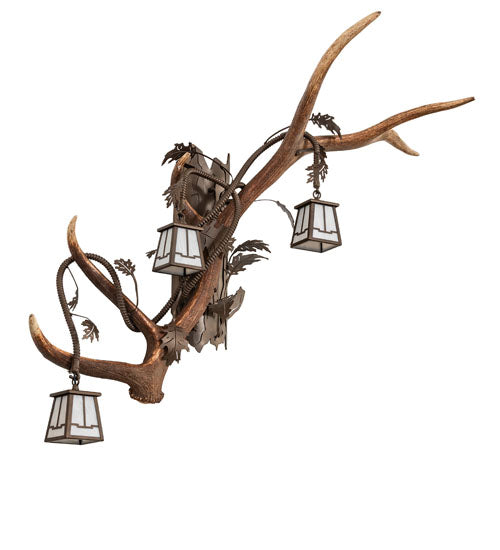Left facing elk and mule deer antler wall sconce with three lantern lights for rustic lodge style, handcrafted in the USA