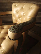 Floral embossed leather arm detail on tufted leather barstool - Your Western Decor
