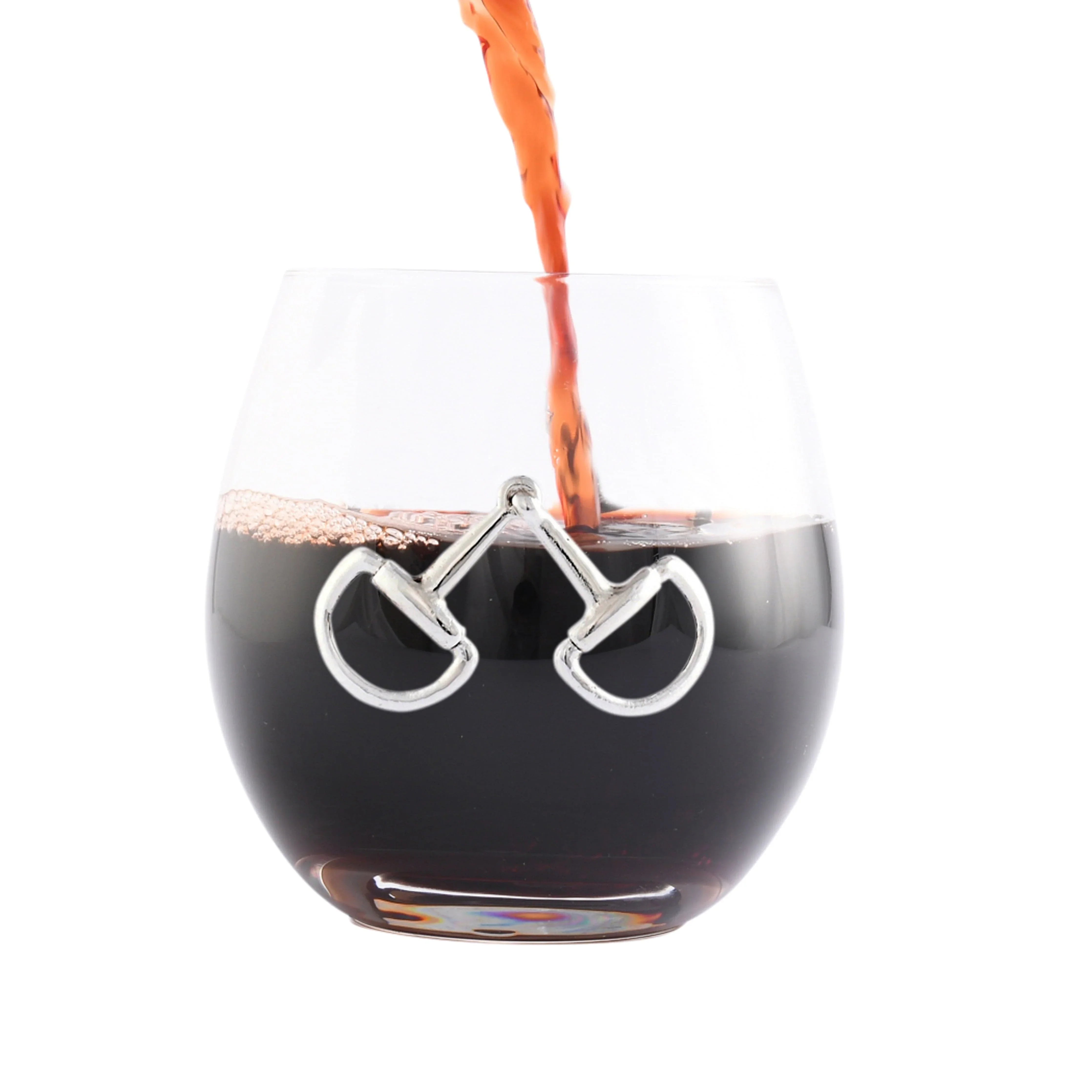 Glass with horse bit design being filled with a dark liquid - Your Western Decor