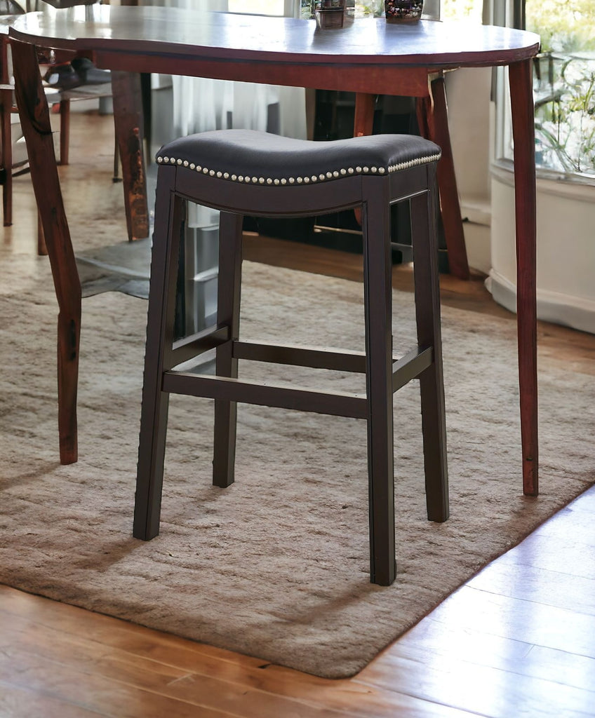 espresso frame with black faux leather upholstered seat saddle style bar stool - Your Western Decor