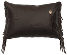 Brown leather pillow with fringe and decorative button on a white background