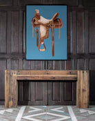 Western Saddle Framed Art - saddle against a blue background - Your Western Decor