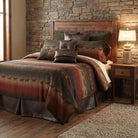 Rustic bedroom with wooden headboard and stone wall, featuring Galloping Trails American made bedding ensemble 