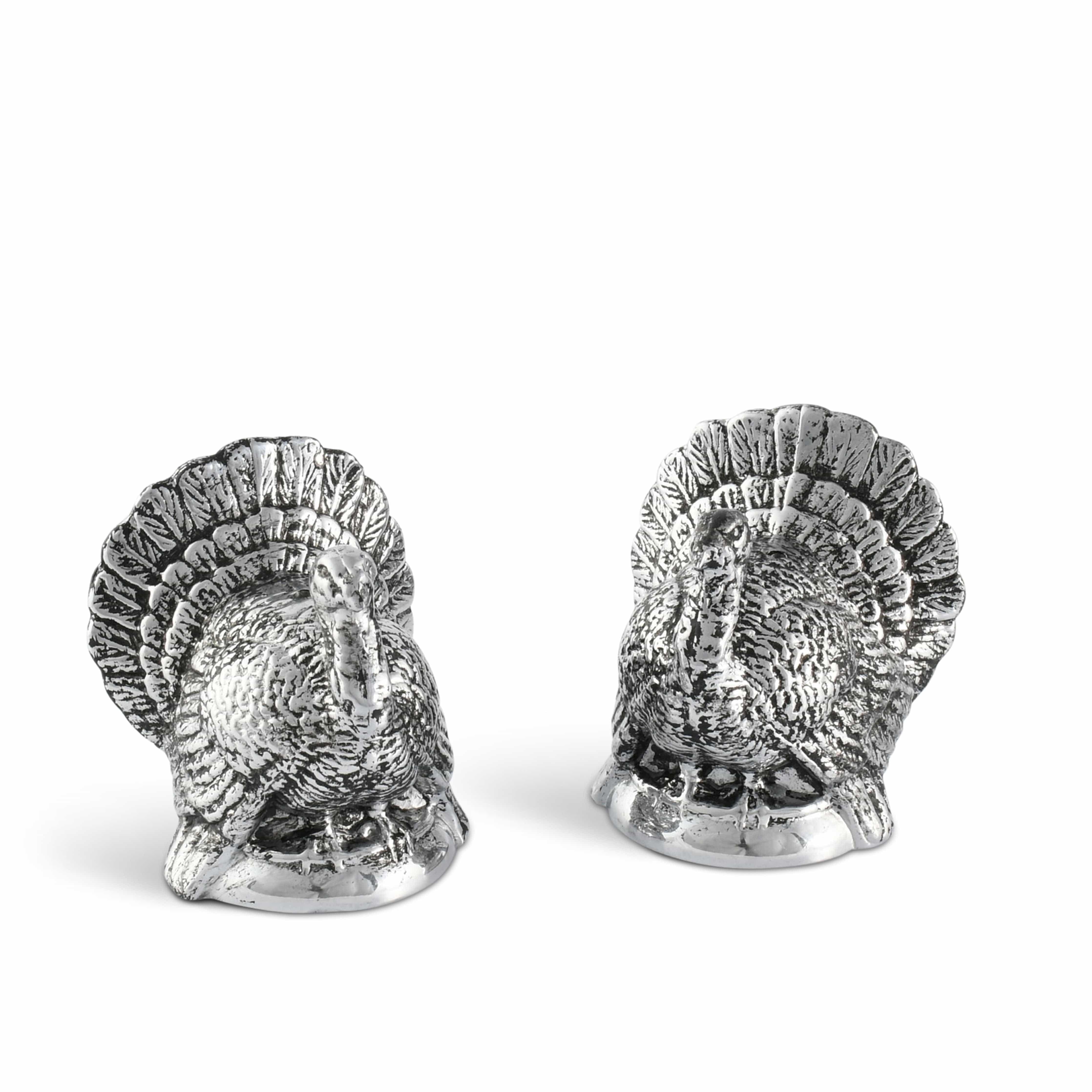 Two silver turkey-shaped salt and pepper shakers on a white background