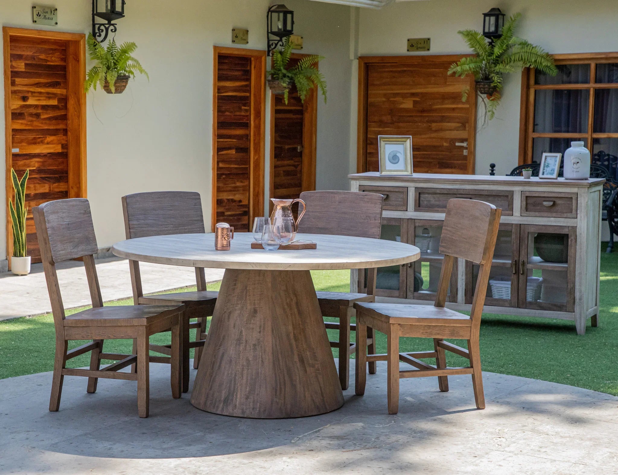Farmhouse mango wood credenza outdoors with wood dining set 