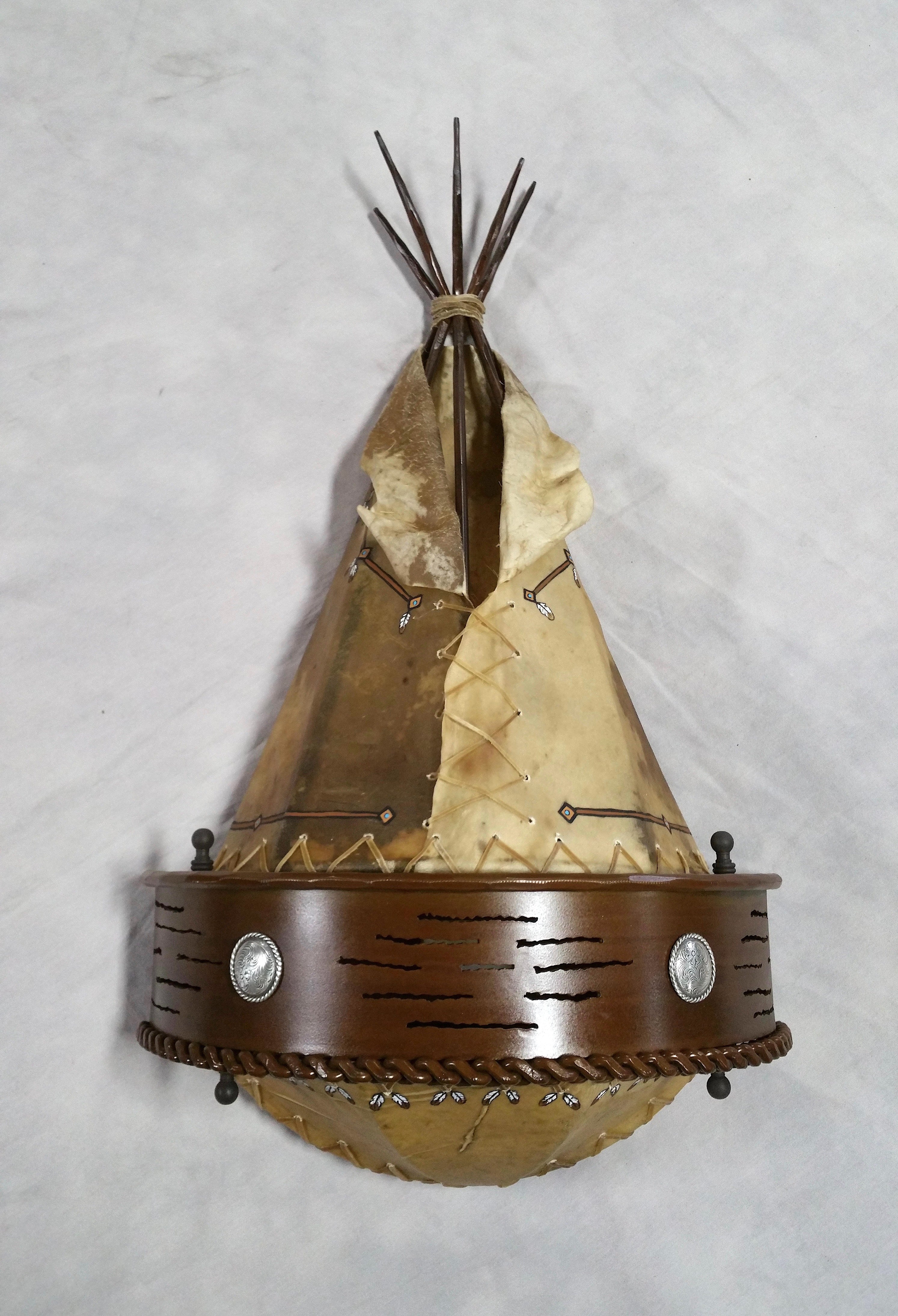 Front view of handmade rawhide tipi wall sconce western rustic wall lighting iron concho lodge decor USA made
