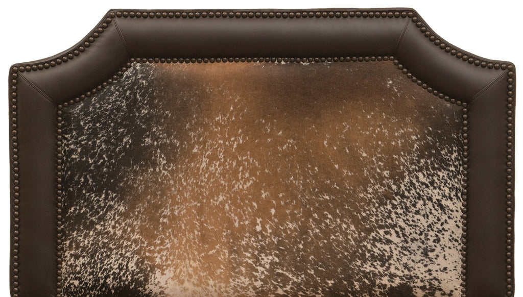 Brown and off-white peppered cowhide and dark brown leather upholstered western headboard. Made in the USA. Your Western Decor