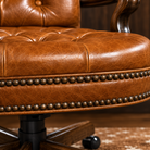 Close-up of diamond tufting, premium leather, and hand-applied nailhead trim.