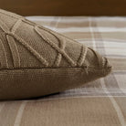 Brown textured pillow on a plaid fabric surface showing hidden zipper closure - Your Western Decor