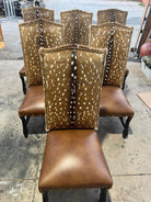 Brown leather chairs with deer skin pattern on a concrete surface - Your Western Decor