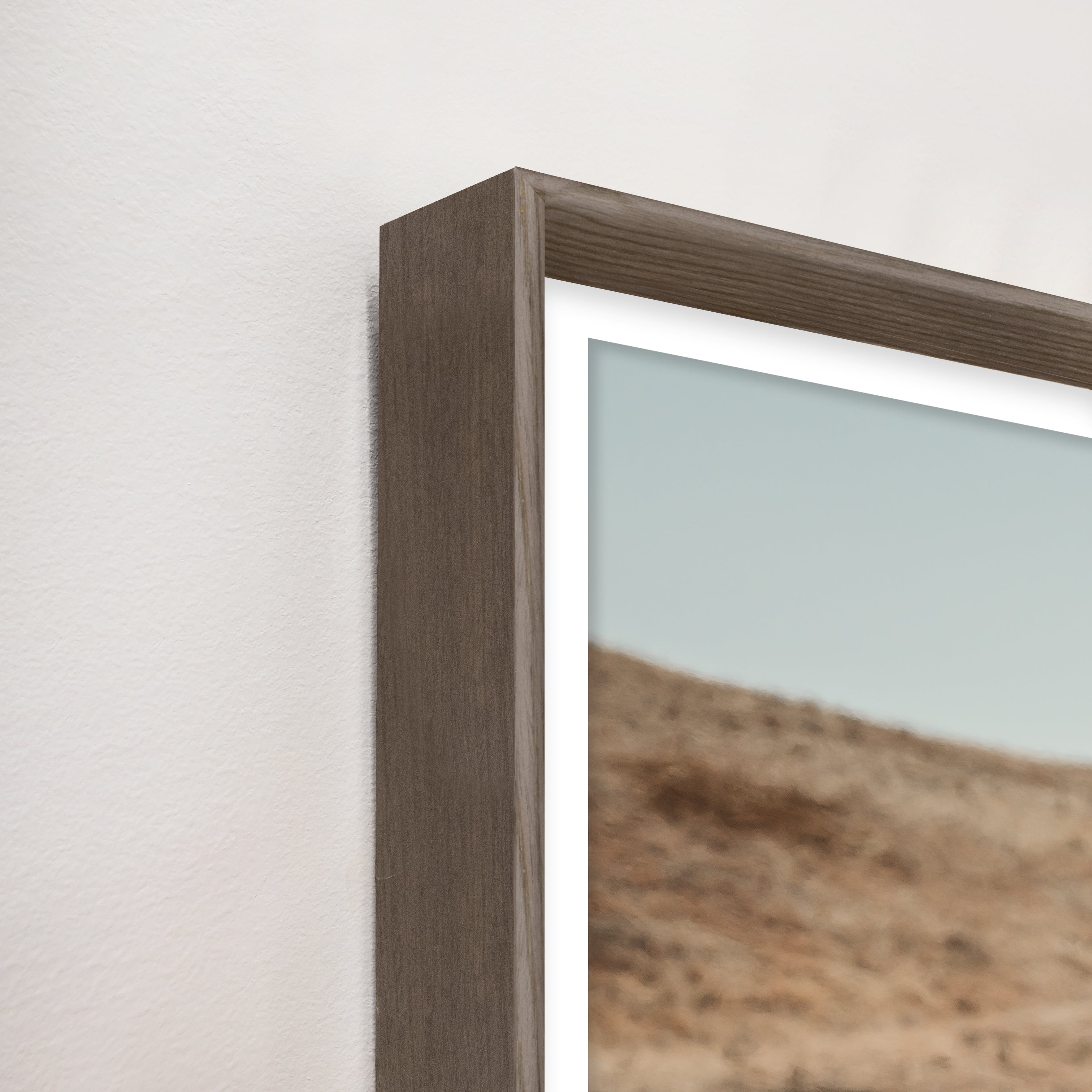 Close-up of a wooden picture frame with a landscape photo inside - Your Western Decor