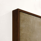 Close-up of a wooden frame corner with a textured beige background - Your Western Decor