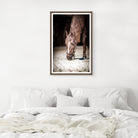 Framed photograph of a horse on a wall above a bed with white bedding - Your Western Decor