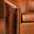 Close up of Houston croc leather swivel chair arm and leather detail 