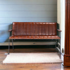 Industrial style bench with channeled leather upholstery - Your Western Decor