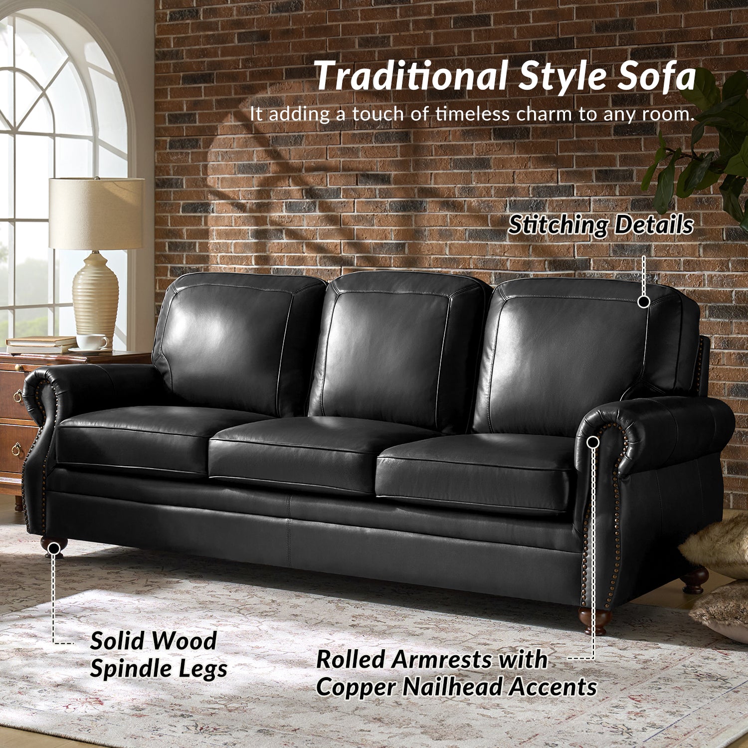 Black leather sofa with solid wood spindle legs and rolled armrests in a room with brick wall and window.