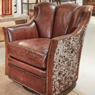 Brown leather swivel chair with peppered brown white cowhide