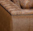 Close-up of a brown leather sofa with textured backrest - Your Western Decor