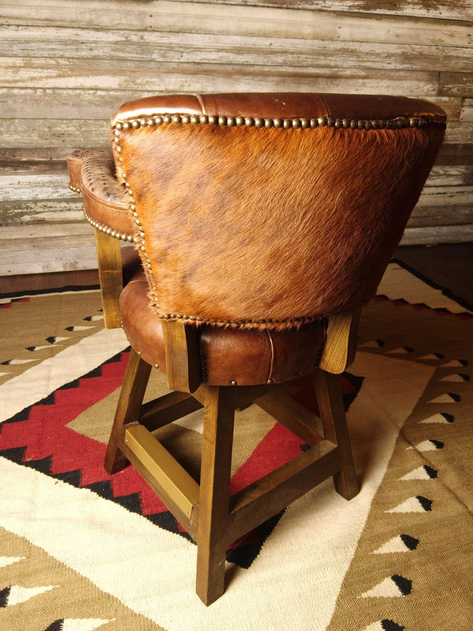 rustic luxury leather bar stool with tufted seat and nailhead trim